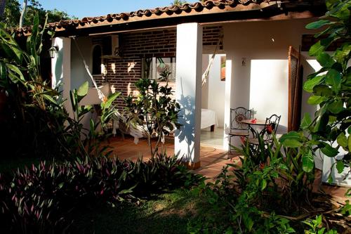 Suíte com vista jardim - Pousada Villa Caju